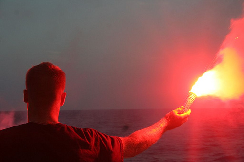 Man holding a boat flare